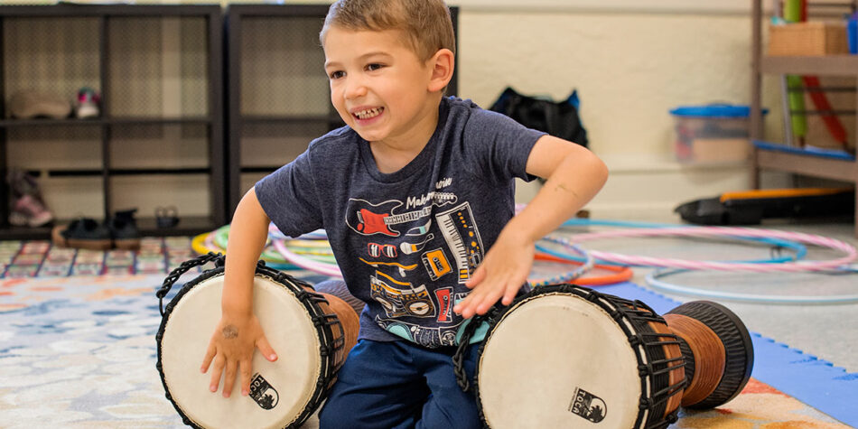 kid playing two drums