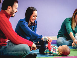 Parents playing with their child