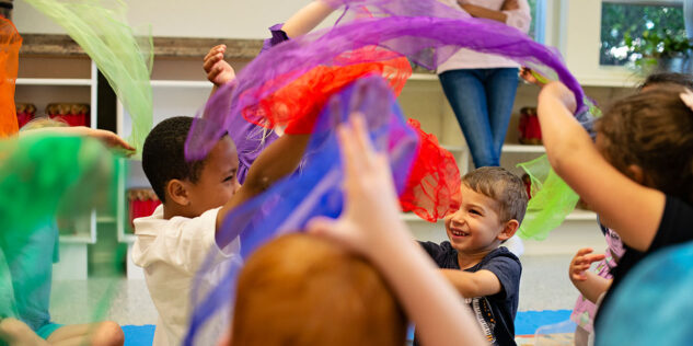 children playing with colorful toys